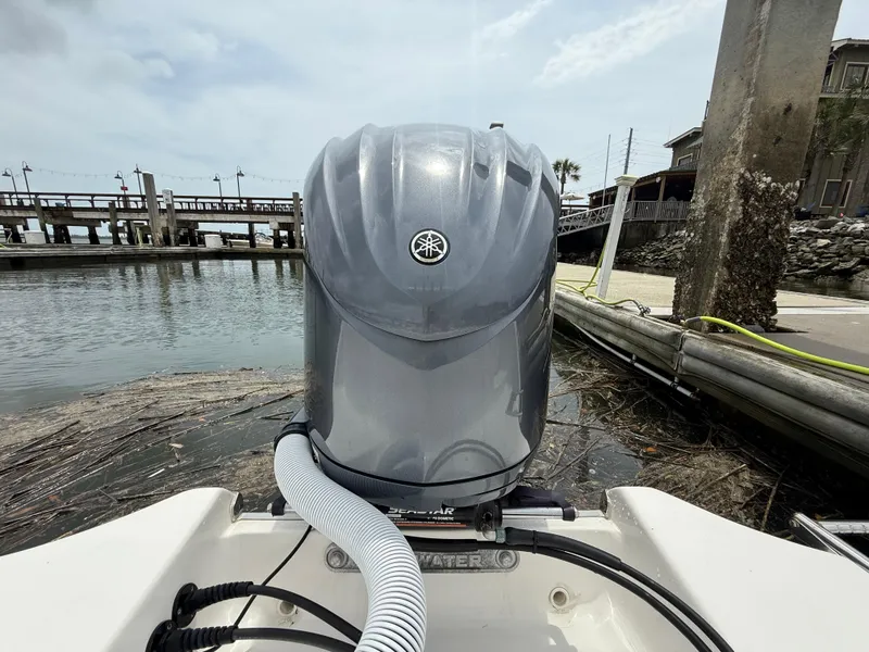 Slide: The Image of 2022 Tidewater 232 CC Adventure boat with Yamaha outboard motor at dockside. - 24
