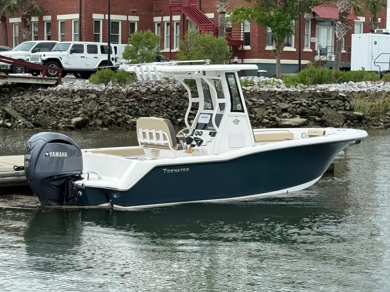 Slide: The Image of 2022 Tidewater 232 CC Adventure boat docked with Yamaha outboard motor. - 3