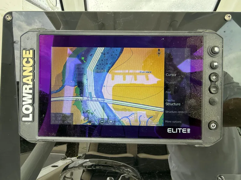 Slide: The Image of Lowrance Elite fishfinder on 2022 Tidewater 232 CC Adventure boat displaying navigational map. - 8