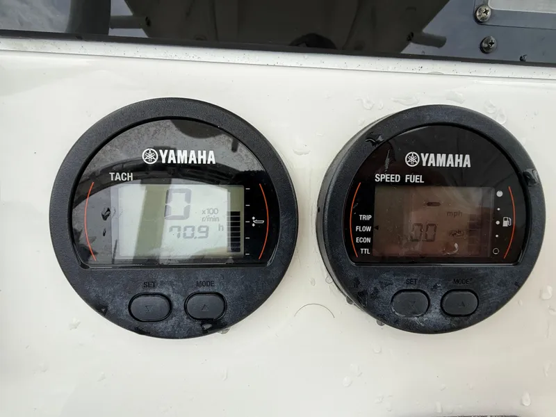 Slide: The Image of Yamaha tachometer and speed fuel gauges on 2022 Tidewater 232 CC Adventure boat. - 9