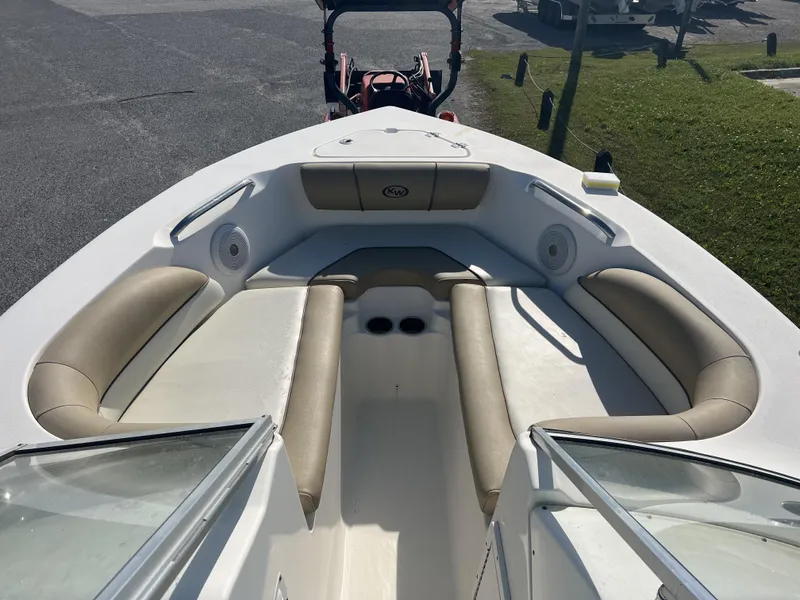 Slide: The Image of 2020 Key West 203DFS boat interior with beige seating and cup holders. - 4