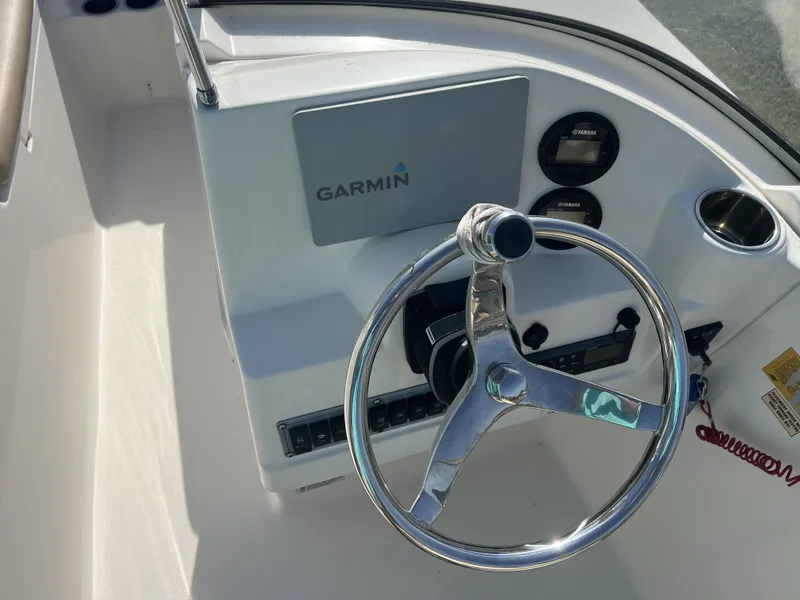 Slide: The Image of Steering console of 2020 Key West 203DFS boat with Garmin display and Yamaha gauges. - 8
