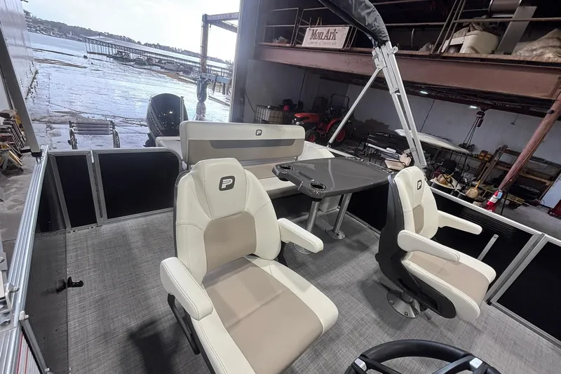 Slide: The Image of 2025 Princecraft Vectra 21 RL pontoon boat interior with seating and table. - 11