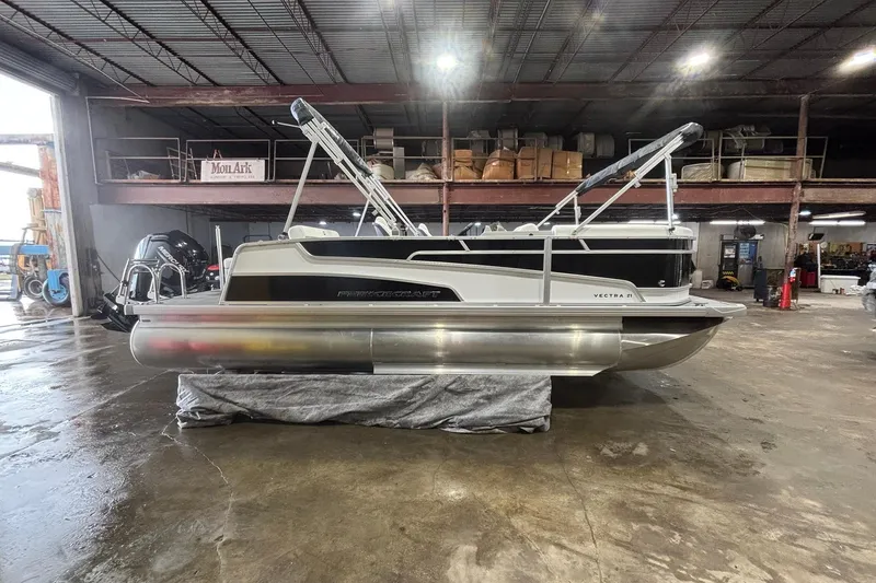 Slide: The Image of 2025 Princecraft Vectra 21 RL pontoon boat in a warehouse setting. - 15