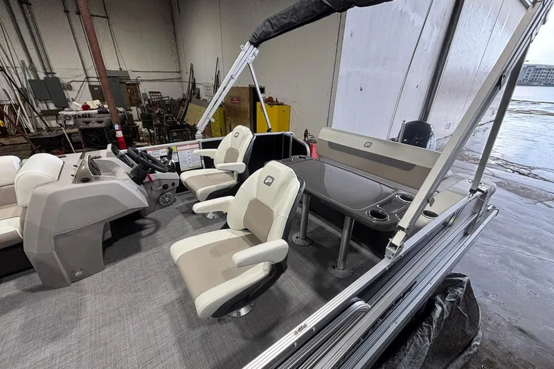 Slide: The Image of 2025 Princecraft Vectra 21 RL pontoon boat interior with seating and helm. - 16