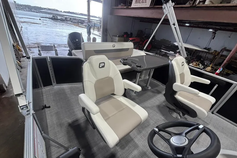 Slide: The Image of 2025 Princecraft Vectra 21 RL pontoon boat interior with seating and steering wheel. - 9