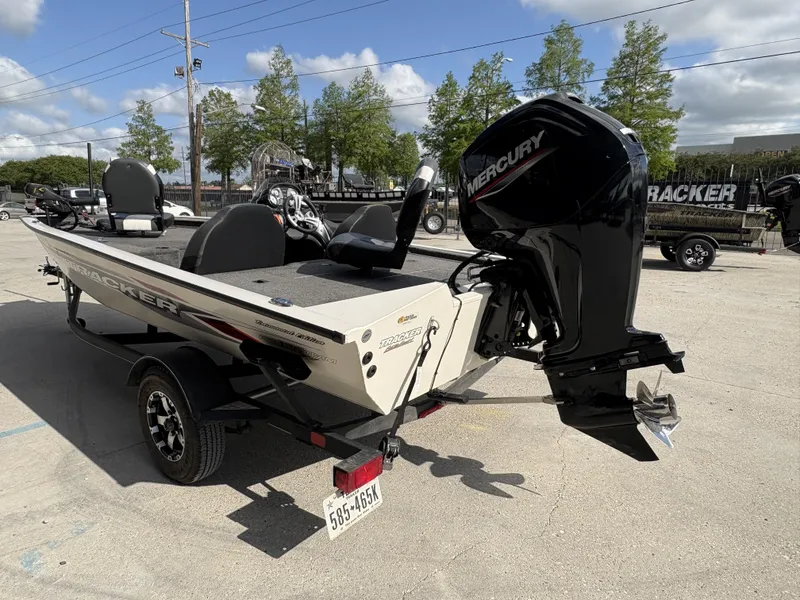 Slide: The Image of 2020 Tracker Pro Team 175 boat with Mercury engine, parked outdoors on a sunny day. - 6