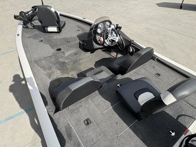 Slide: The Image of 2020 Tracker Pro Team 175 boat interior with seating and control panel. - 9