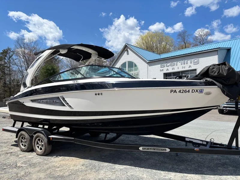 Slide: The Image of 2019 Regal 25 RX Surf boat on trailer at Sterling Marina. - 11