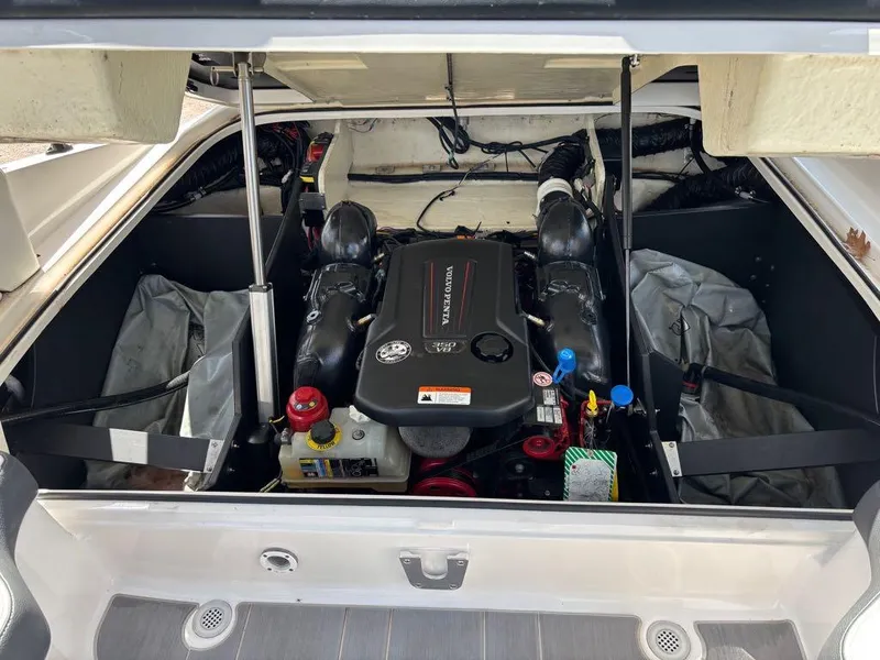 Slide: The Image of Engine compartment of a 2019 Regal 25 RX Surf boat, featuring a Volvo Penta engine. - 17