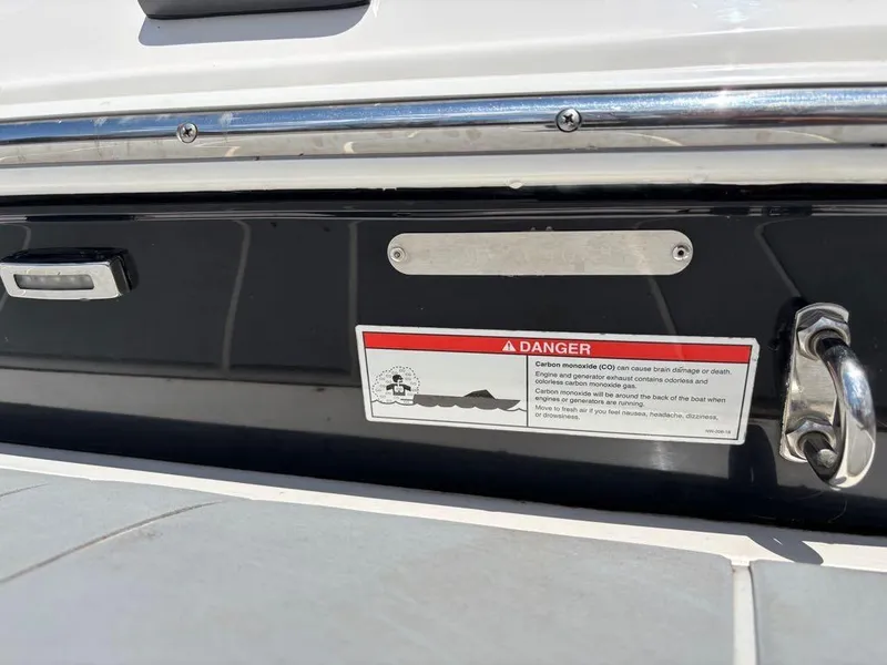Slide: The Image of 2019 Regal 25 RX Surf boat with carbon monoxide warning label. - 20