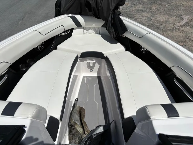 Slide: The Image of 2019 Regal 25 RX Surf boat interior with white seating and black accents. - 5