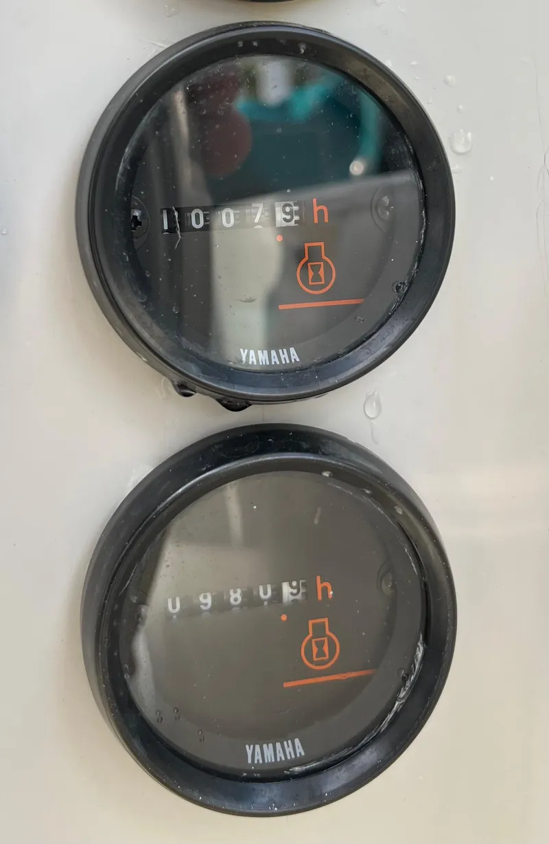 Slide: The Image of Yamaha hour meters on a PDQ 32 boat, displaying engine hours. - 22