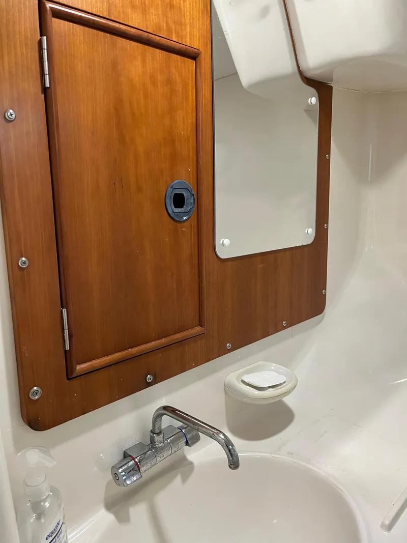 Slide: The Image of Wooden cabinet and sink in PDQ 32 boat bathroom, 2003 model. - 30