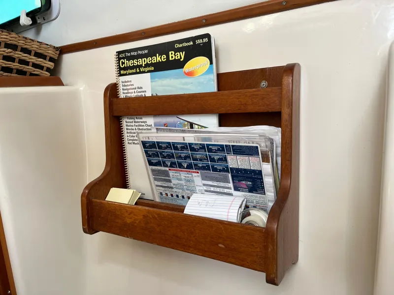 Slide: The Image of Wooden wall rack holding Chesapeake Bay chartbook and notes, PDQ 32, 2003. - 34