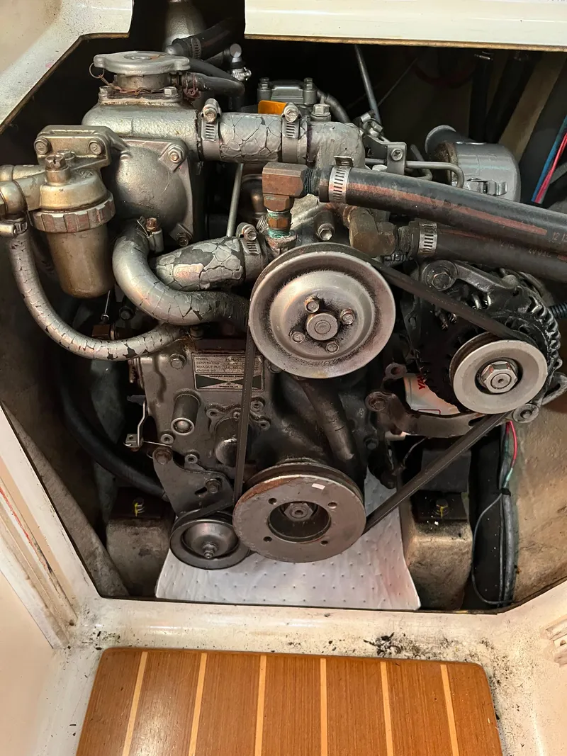 Slide: The Image of Engine compartment of a 2003 PDQ 32, showing belts and components. - 37