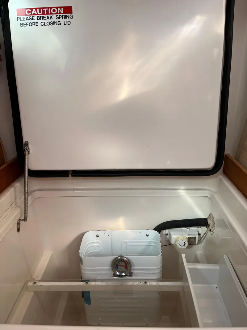 Slide: The Image of Open storage compartment with caution label, PDQ 32 model, 2003. - 39