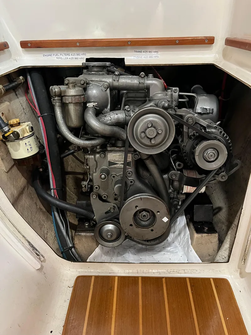 Slide: The Image of Engine compartment of a 2003 PDQ 32 boat, showing detailed mechanical components. - 40