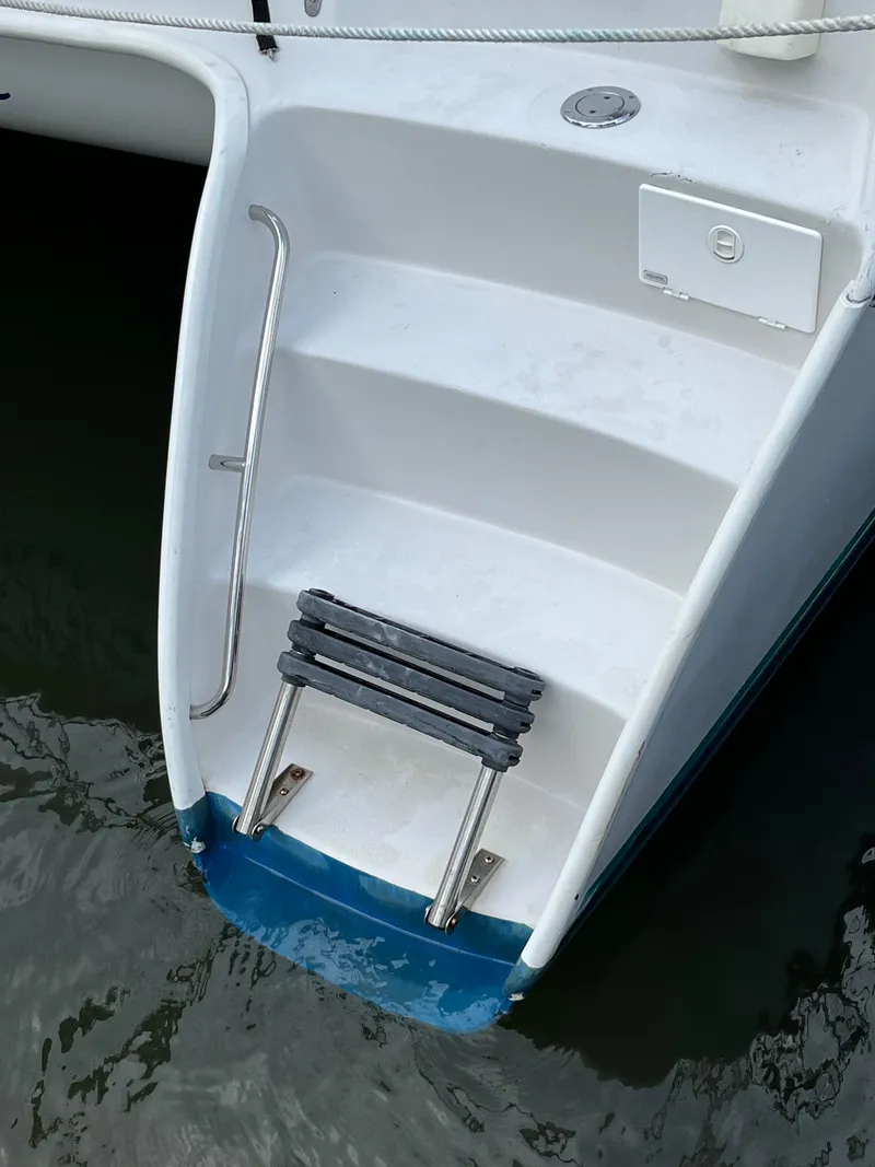 Slide: The Image of Boat swim platform with ladder, PDQ 32 model, 2003, on calm water. - 8