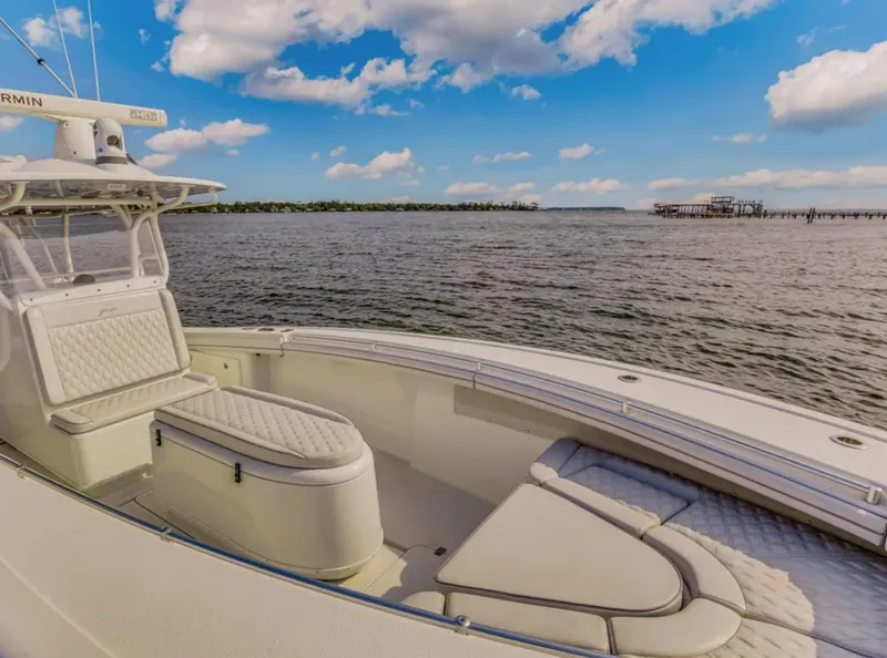 Slide: The Image of 2017 Yellowfin 36 Offshore boat on calm water under a blue sky with clouds. - 20