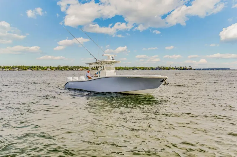 Slide: The Image of 2017 Yellowfin 36 Offshore boat on open water under a partly cloudy sky. - 21