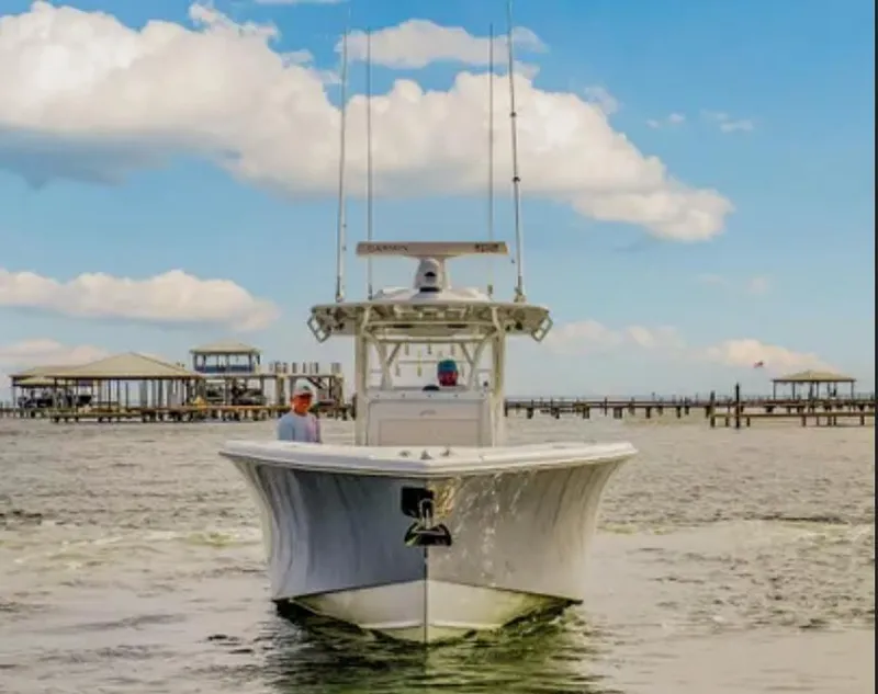 Slide: The Image of 2017 Yellowfin 36 Offshore boat on water with docks in background. - 3