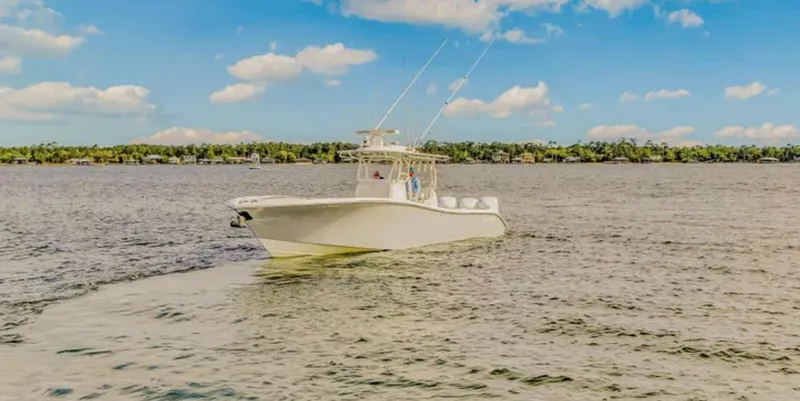 Slide: The Image of 2017 Yellowfin 36 Offshore boat cruising on a sunny day with blue skies. - 5