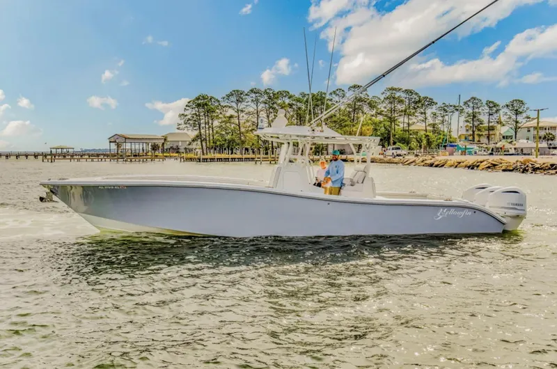 Slide: The Image of 2017 Yellowfin 36 Offshore boat cruising on a sunny day near a coastal area. - 6