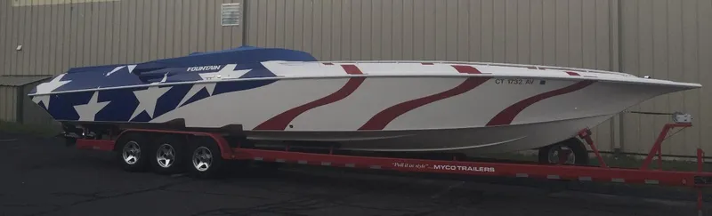 Slide: The Image of 1998 Fountain 42 Lightning speedboat with patriotic design on a red trailer. - 17