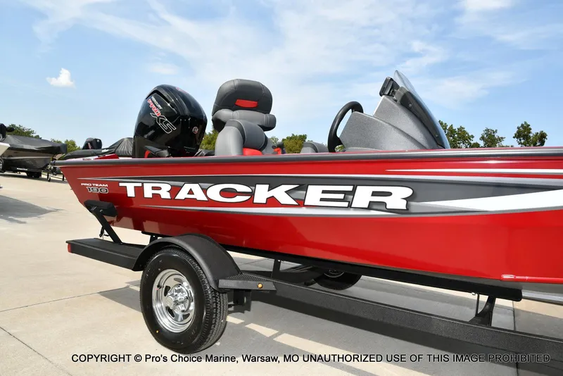 Slide: The Image of 2025 Tracker Pro Team 190 TX boat in vibrant red on a trailer. - 15