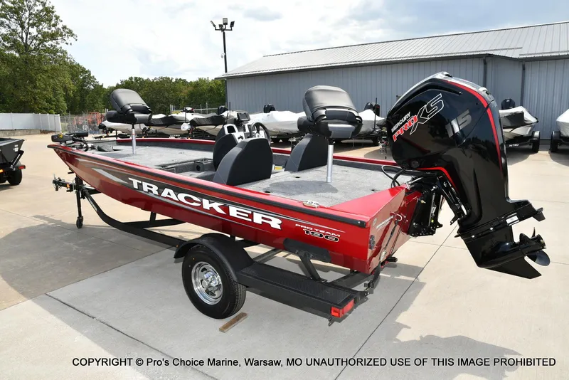Slide: The Image of 2025 Tracker Pro Team 190 TX boat with Mercury Pro XS engine, parked outdoors. - 22