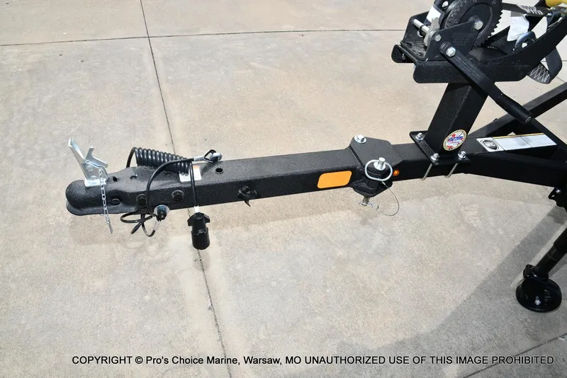 Slide: The Image of Trailer hitch of 2025 Tracker Pro Team 190 TX boat on concrete surface. - 28
