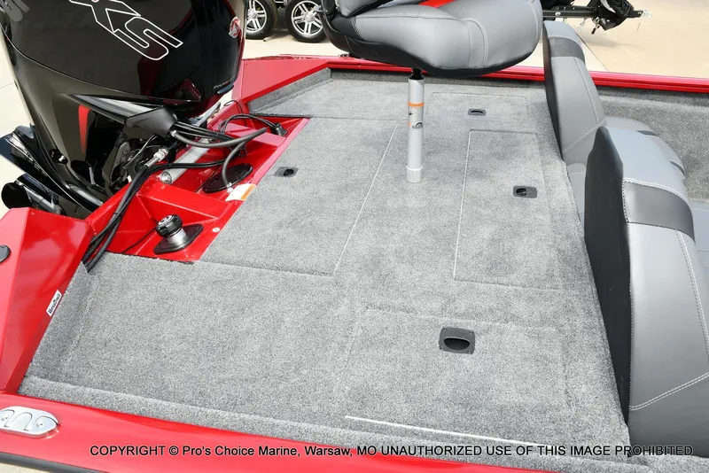 Slide: The Image of 2025 Tracker Pro Team 190 TX boat interior with gray carpet and seating. - 30