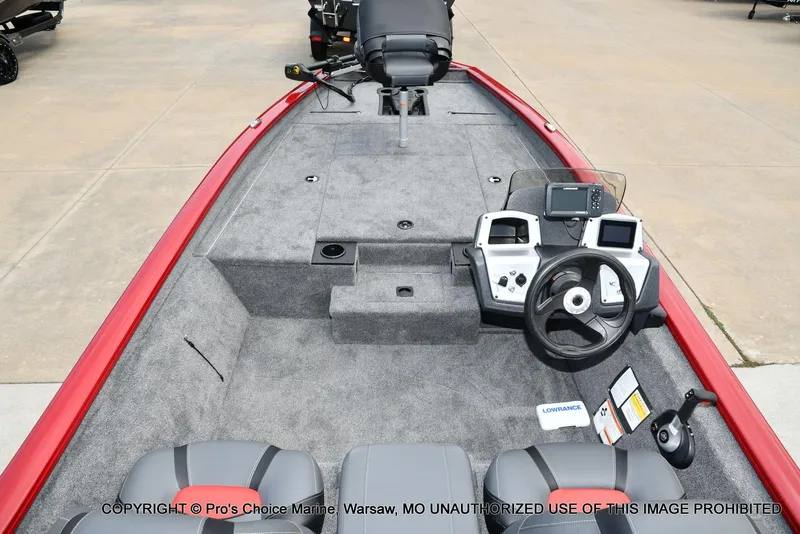Slide: The Image of 2025 Tracker Pro Team 190 TX boat interior with steering console and seating. - 33