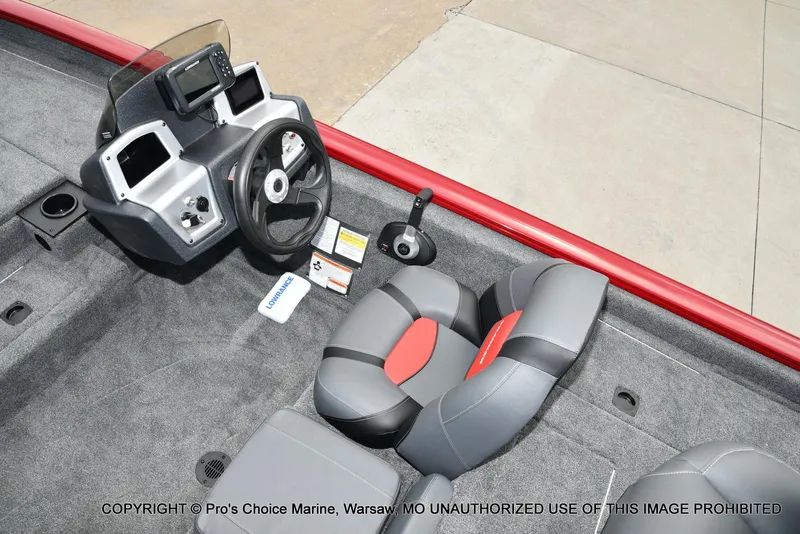Slide: The Image of 2025 Tracker Pro Team 190 TX boat interior with steering console and seating. - 34