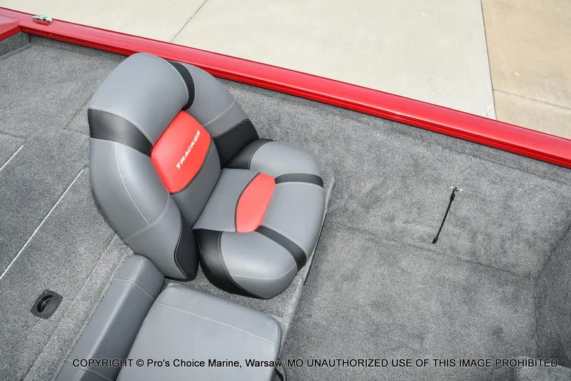 Slide: The Image of 2025 Tracker Pro Team 190 TX boat seat with red and gray upholstery. - 37