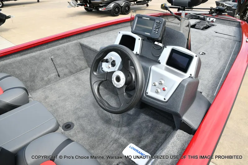 Slide: The Image of 2025 Tracker Pro Team 190 TX boat interior with steering wheel and control panel. - 5