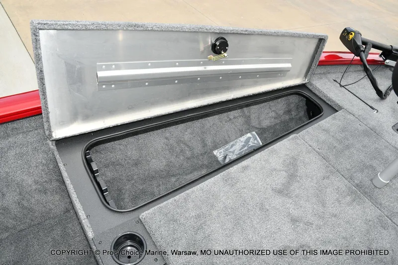 Slide: The Image of 2025 Tracker Pro Team 190 TX boat storage compartment with open lid, showcasing interior space. - 50