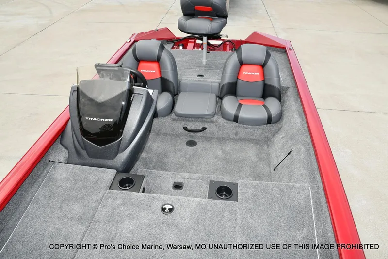 Slide: The Image of 2025 Tracker Pro Team 190 TX boat interior with gray and red seating. - 8