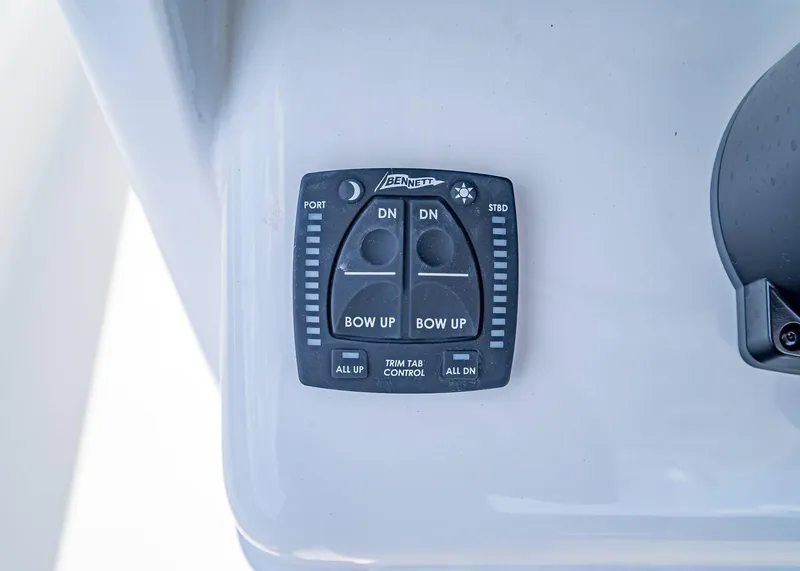 Slide: The Image of Trim tab control panel on 2025 Sea Hunt Gamefish 25 boat. - 13