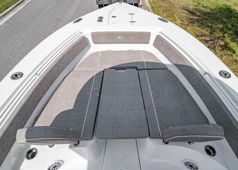 Slide: The Image of 2025 Sea Hunt Gamefish 25 boat with cushioned seating and sleek design. - 23