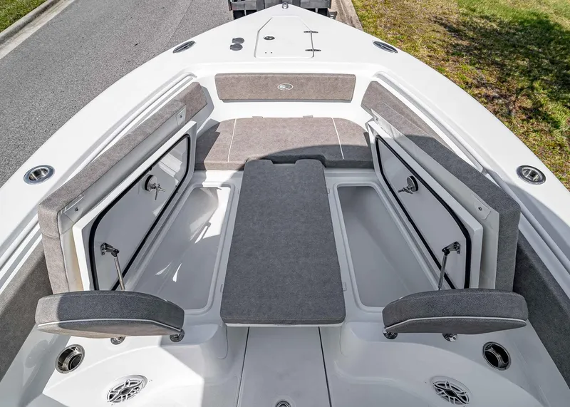 Slide: The Image of 2025 Sea Hunt Gamefish 25 boat interior with open storage compartments and seating. - 24