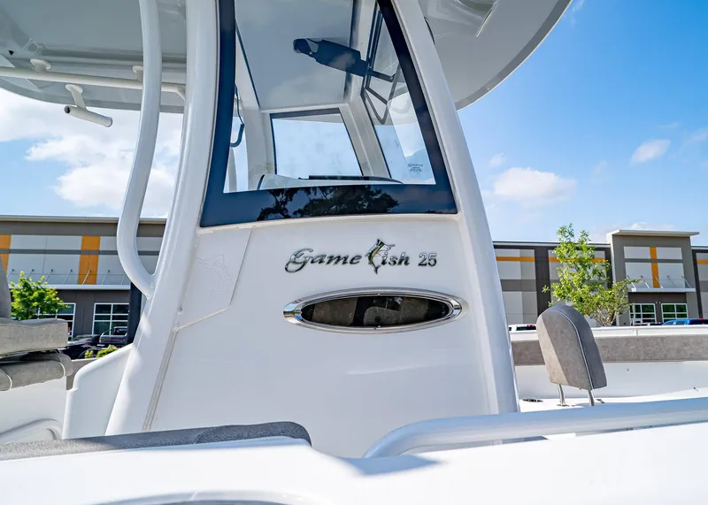 Slide: The Image of 2025 Sea Hunt Gamefish 25 boat console with modern design and branding. - 6