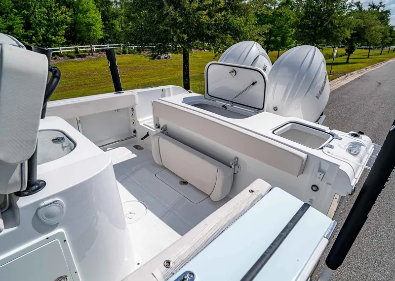 Slide: The Image of 2025 Sea Hunt Gamefish 25 boat interior with dual engines and seating. - 12