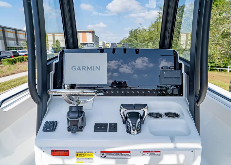 Slide: The Image of 2025 Sea Hunt Gamefish 25 dashboard with Garmin navigation system and controls. - 15