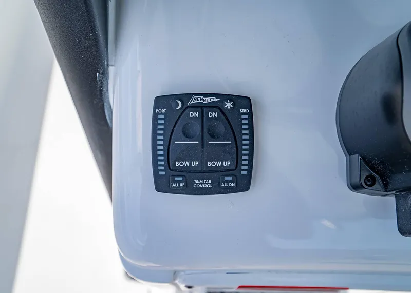 Slide: The Image of Trim tab control panel on 2025 Sea Hunt Gamefish 25 boat. - 17