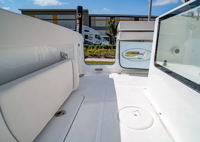 Slide: The Image of 2025 Sea Hunt Gamefish 25 boat interior, featuring spacious deck and seating. - 23