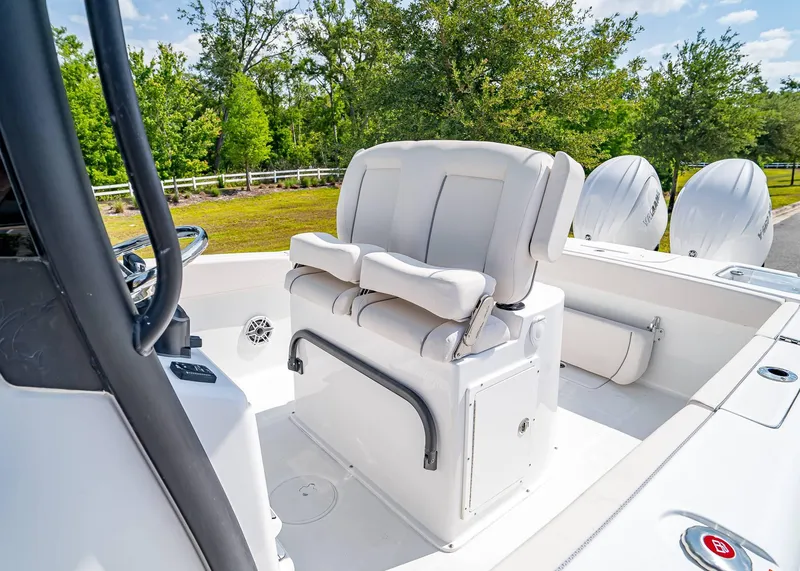 Slide: The Image of 2025 Sea Hunt Gamefish 25 boat interior with dual seats and twin outboard engines. - 25
