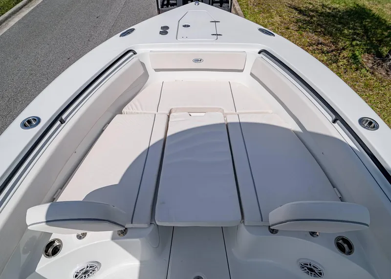 Slide: The Image of 2025 Sea Hunt Gamefish 25 boat interior with cushioned seating and sleek design. - 26