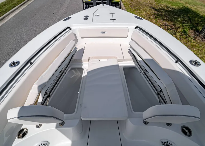 Slide: The Image of 2025 Sea Hunt Gamefish 25 boat interior with cushioned seating and storage compartments. - 27